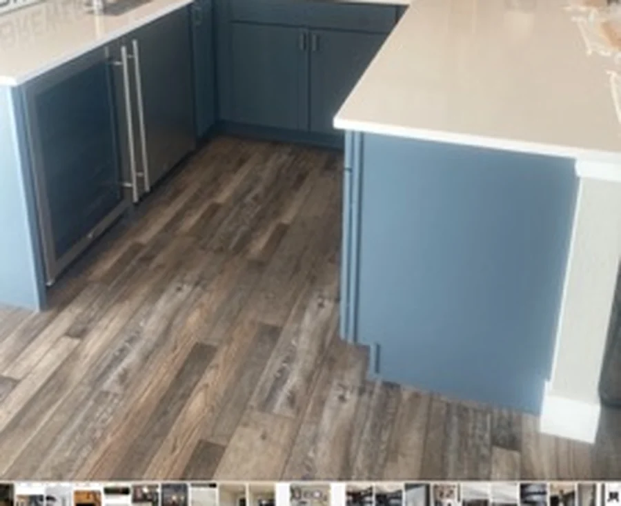 Kitchen and laundry area with blue cabinets