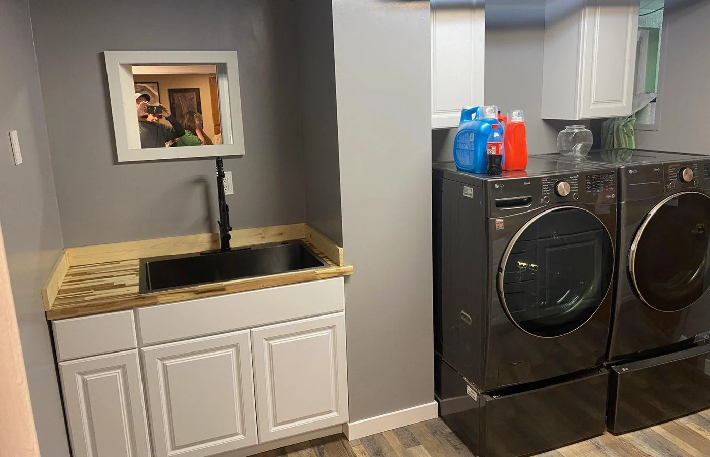 Laundry room with utility sink and washer dryer