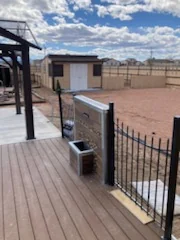 Outdoor deck with railing and yard view